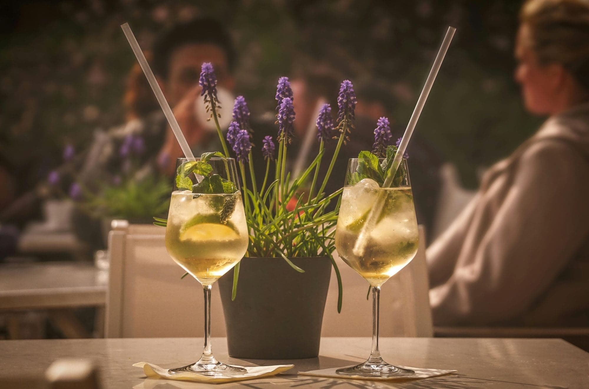 Two glasses of white wine at sunset